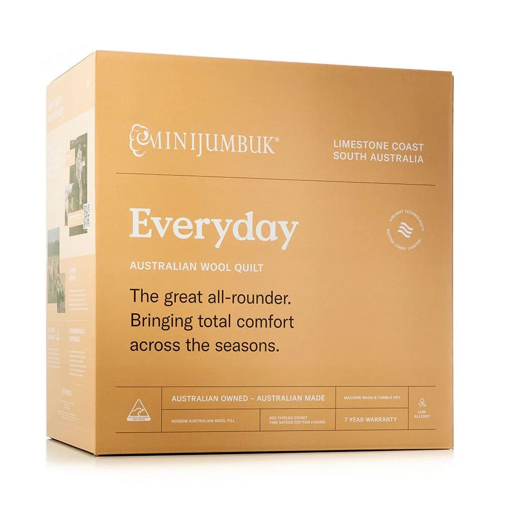 Box of Minijumbuk Australian wool quilt on a white background