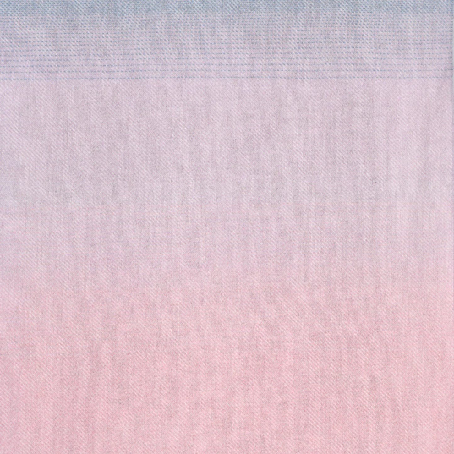 Gradient fabric texture transitioning from light blue to pink