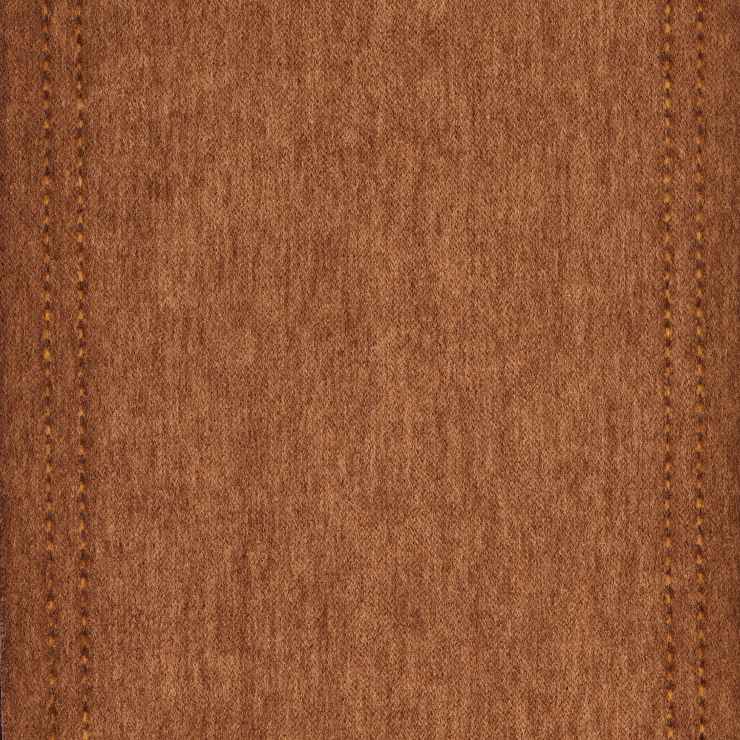Close-up of brown wool fabric texture with stitching details