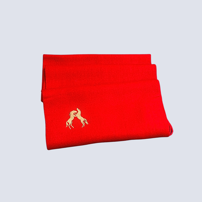 Purple scarf with gold embroidery on a gray background, featuring the WooliWooli brand.