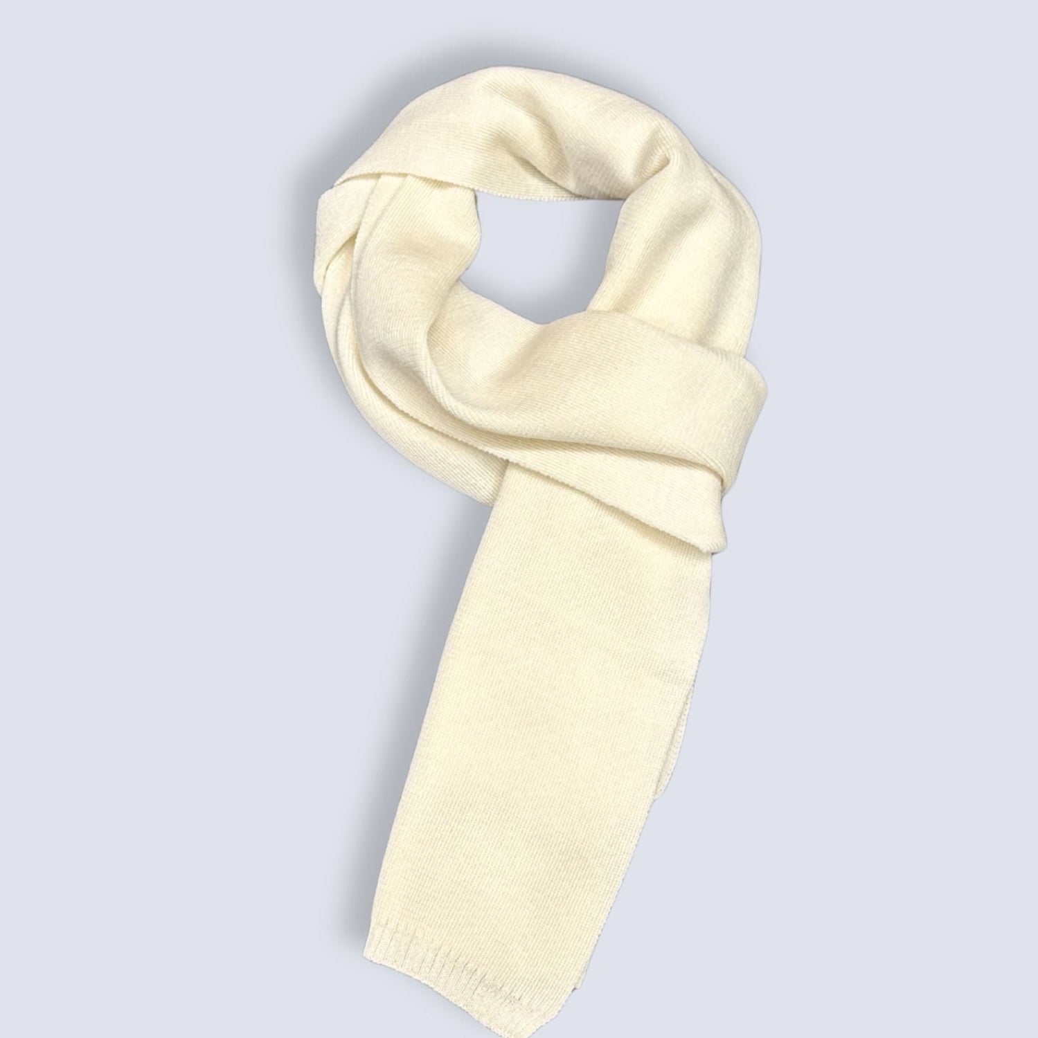 Cream-colored scarf on a light gray background