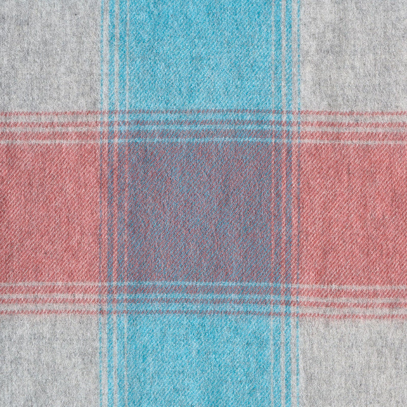 Coral Coast scarf flat lay showing wool texture in coral, blue, grey and red.