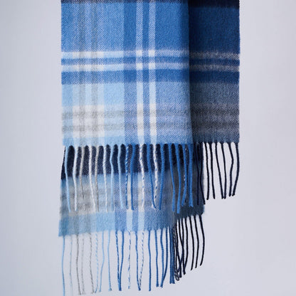 A blue-toned checkered merino wool scarf with fringes, displayed against a neutral background. 30cm*170cm merino wool scarf.