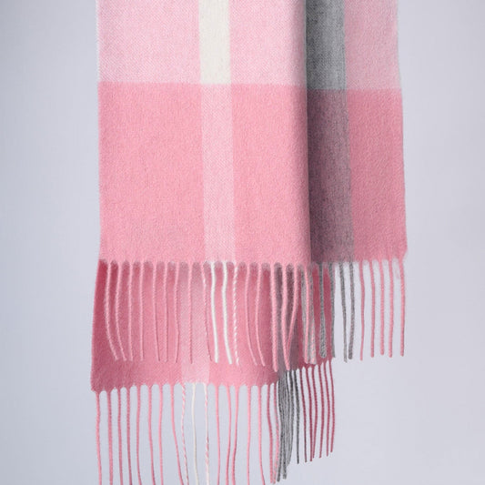 A pink and gray plaid-patterned scarf with fringes.