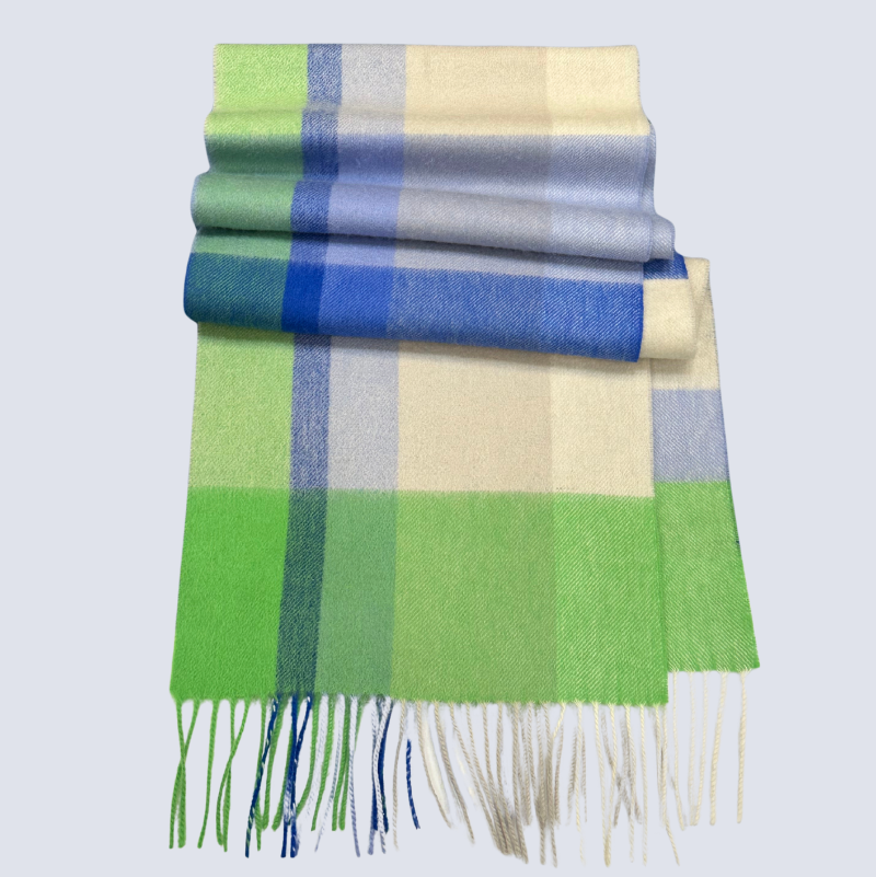 Plaid scarf with green, blue, and beige colors on a light gray background