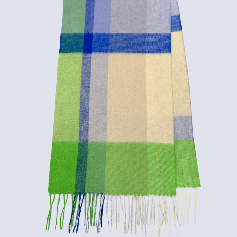 Plaid scarf with green, blue, gray, and beige colors on a light gray background
