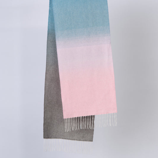 Gradient scarf transitioning from blue to pink on a light gray background