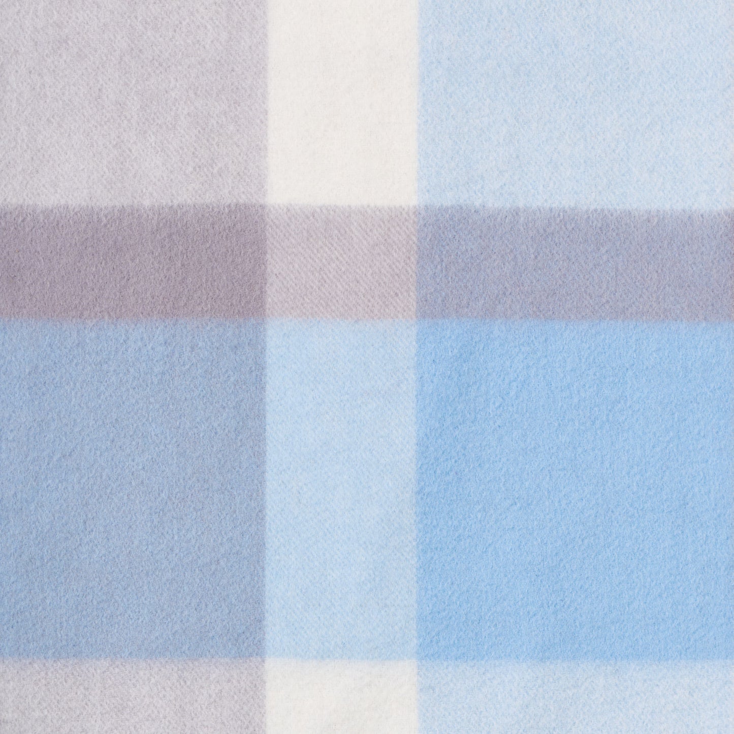 Close-up of a plaid wool fabric with brown, beige, and blue colours.