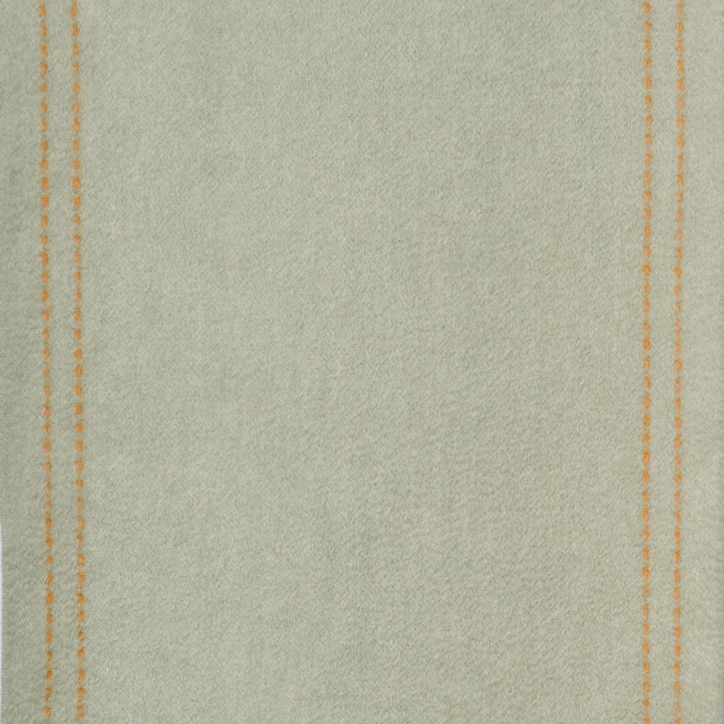 Close-up of wool fabric texture with stitching details