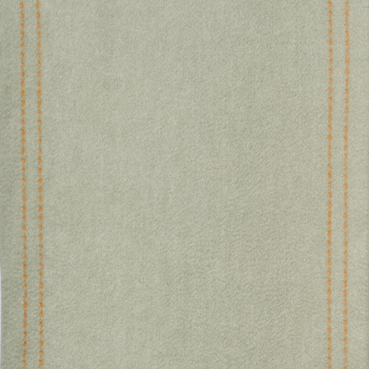 Close-up of wool fabric texture with stitching details