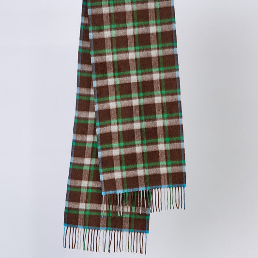 Plaid wool scarf with brown, green, and white patterns on a light gray background