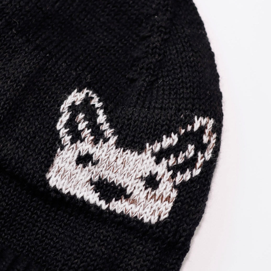 Black knit beanie with a white embroidered Kangaroo design on a white background