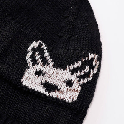 Black knit beanie with a white embroidered Kangaroo design on a white background
