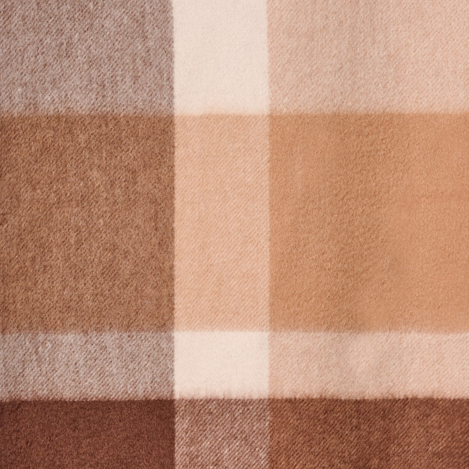 Flat lay of a solid colour wool scarf, a wool scarf showing the material.