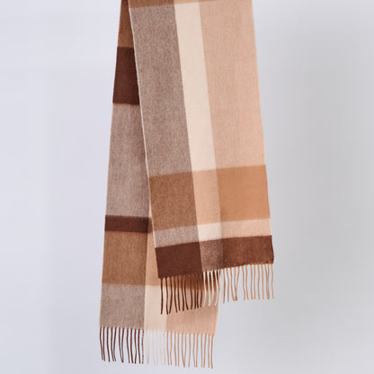 Plaid wool scarf with brown and beige colors on a light gray background