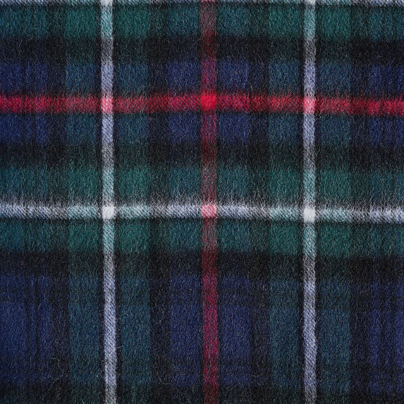Close-up of a plaid fabric with blue, red, and green colors.
