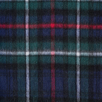 Close-up of a plaid fabric with blue, red, and green colors.