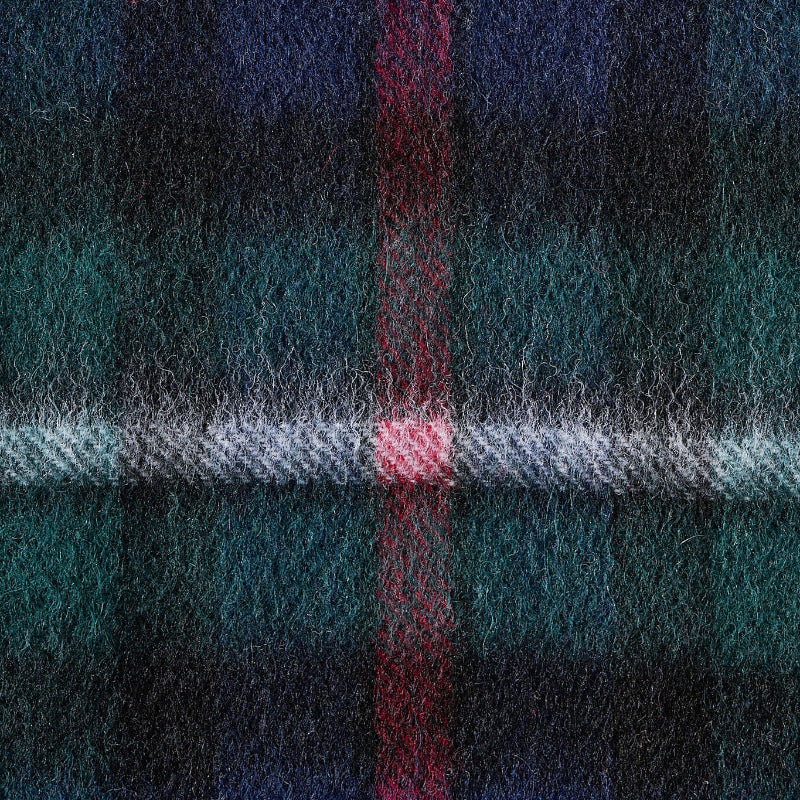 Close-up of a plaid fabric with blue, green, and red colors.