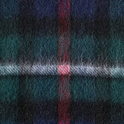 Close-up of a plaid fabric with blue, green, and red colors.