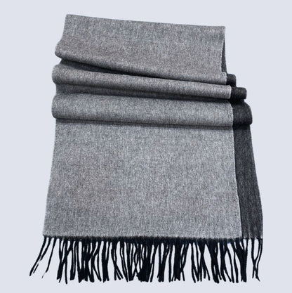 Black and Grey double-sided shawl with black fringe on a light gray background