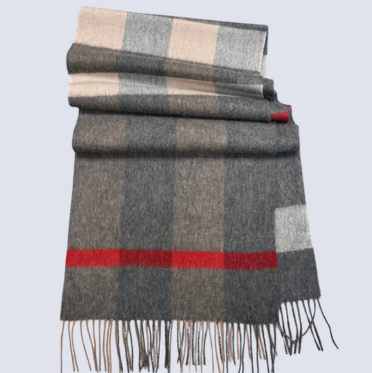 Checkered scarf with gray, beige, and red colors on a light gray background