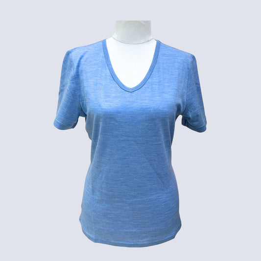 Blue t-shirt on a mannequin against a light gray background