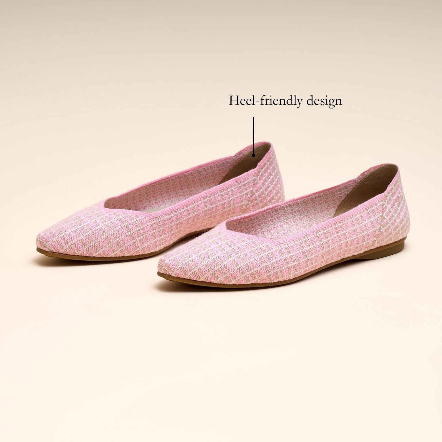 Pink flat shoes with a textured pattern on a beige background