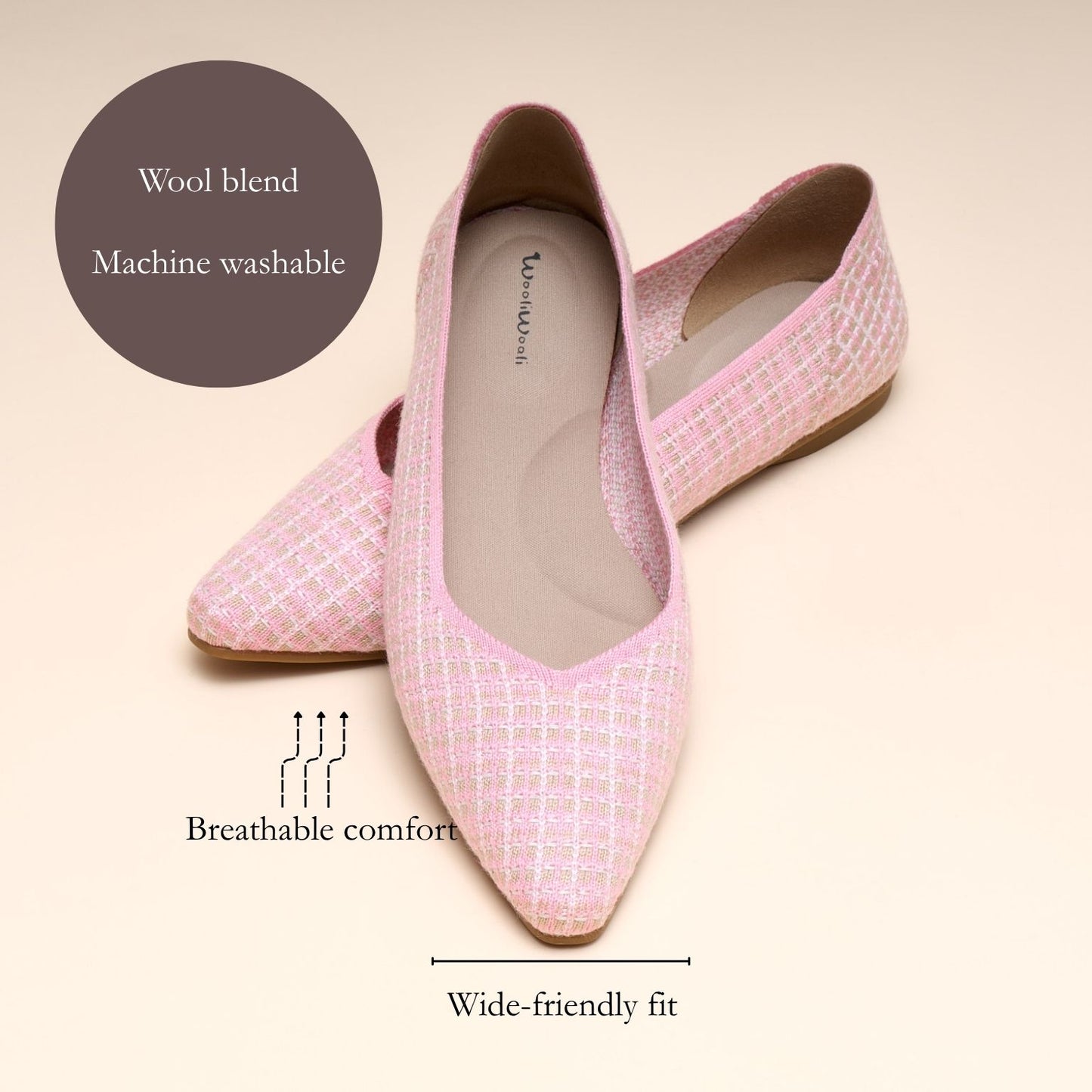 Pink loafers with text highlighting features on a beige background