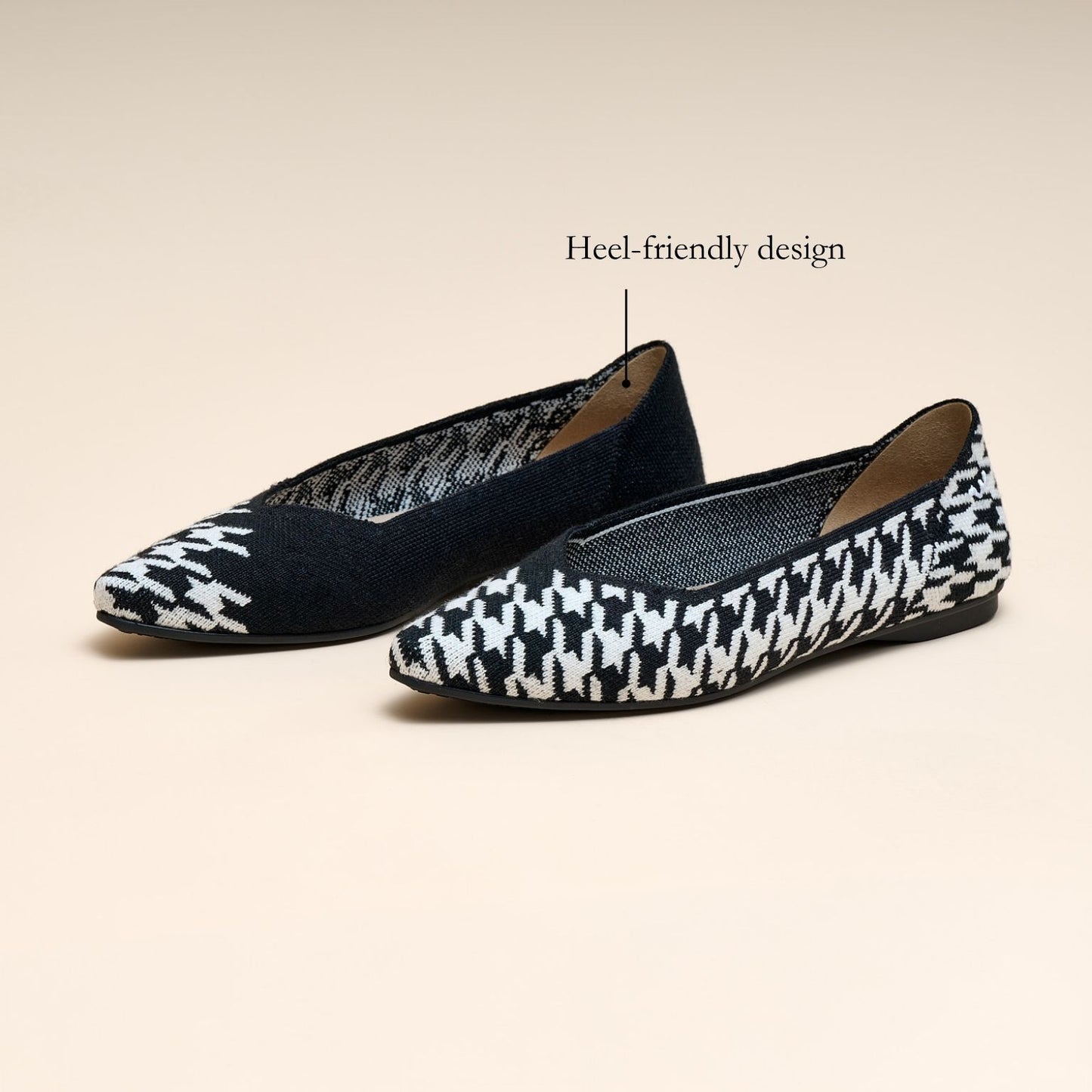 Pair of black and white patterned flats on a beige background with 'Heel-friendly design' text.