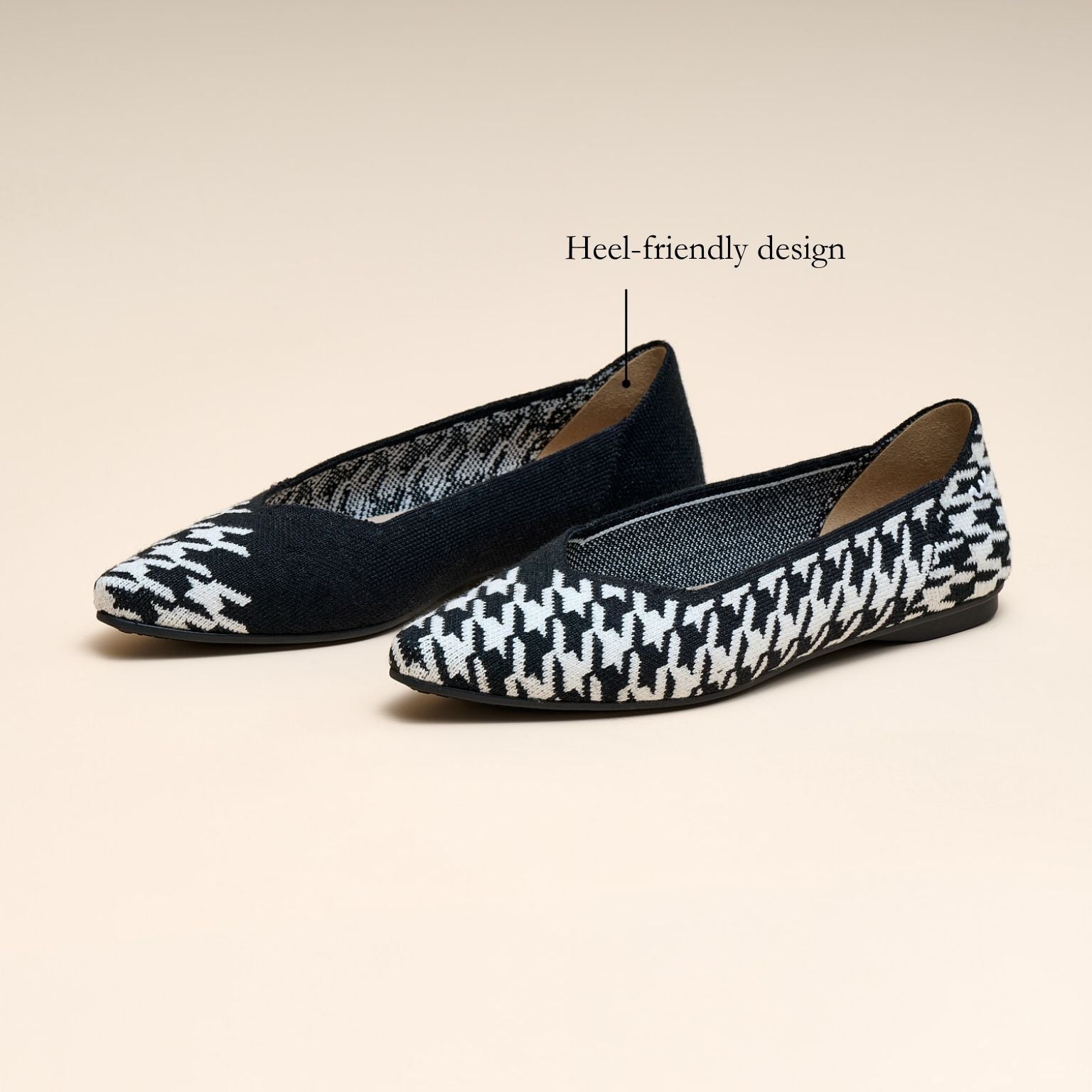 Pair of black and white patterned flats on a beige background with 'Heel-friendly design' text.