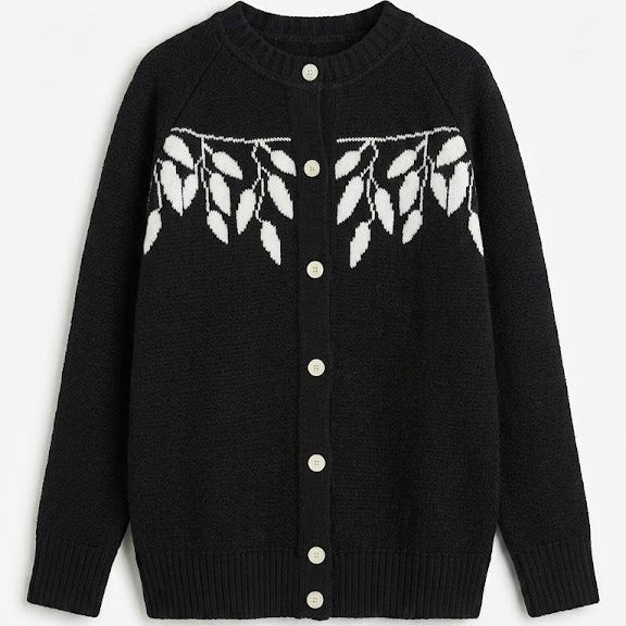 Black cardigan with white button details and leaf pattern on a white background
